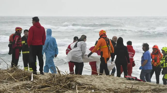 Overcrowded wooden boat smashes into rocky reefs off southern Italy, 43 dead